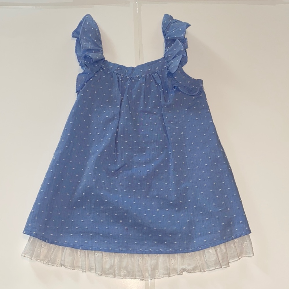 Ruffle top a babydoll dress with lace at the trim